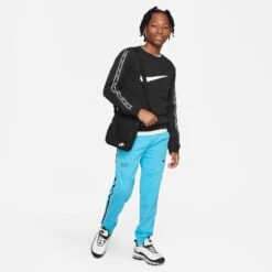 Nike Sweatpants NSW Repeat - Baltic Blue/Black Kids -Sports Clothing a9e9570543b6